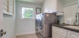 Laundry room with sink is located upstairs